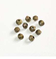 Металеві намистини, Біконус (6,0*5,0 мм.) Колір: бронза. Упаковка: 10 шт. 59984-b