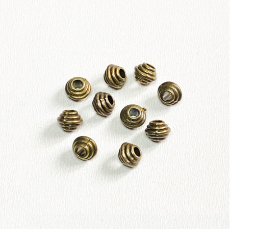 Металеві намистини, Біконус (6,0*5,0 мм.) Колір: бронза. Упаковка: 10 шт. 59984-b